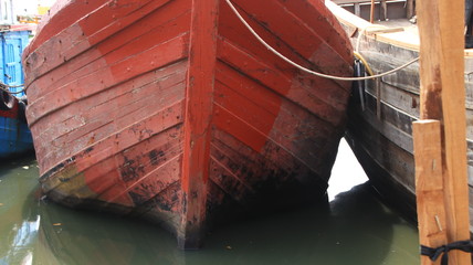 Timber shipbuilder working while working at a shipyard, Batang Indonesia,