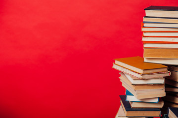 stacks of educational books university library background