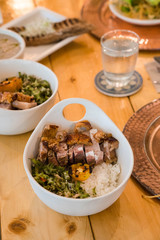 crispy pork belly with coconut vegetables rice bowl