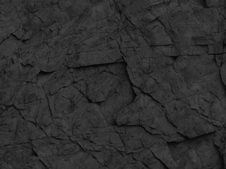 Black rocks texture. Dark stone texture background. Mountain close-up.