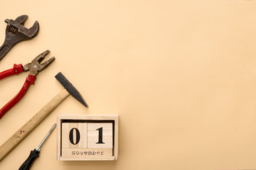November 1st. Day 1 of November set on wooden calendar on on beige background