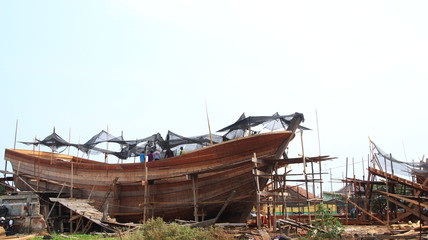 Timber shipbuilder working while working at a shipyard, Batang Indonesia, 14 October 2019
