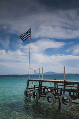 greek flag on the pier