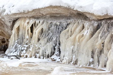 Snow covered icy waterfall for postcard