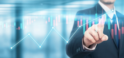 Obraz premium Businessman plan graph growth increase of chart positive indicators in his business