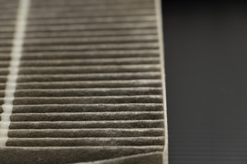 Old dirty automotive cabin air filter texture isolated on black background
