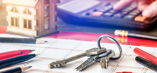 Fototapeta premium House keys the real estate property background.Home insurance concept