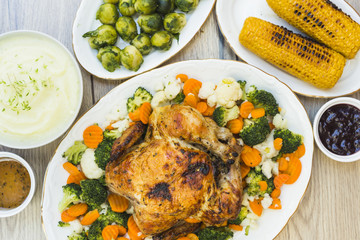 Table covered with baked chicken and potato puree