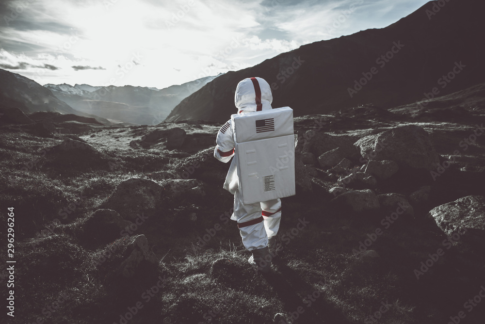 Poster astronaut exploring a new planet. searching for a new home for humanity. concept about science and n