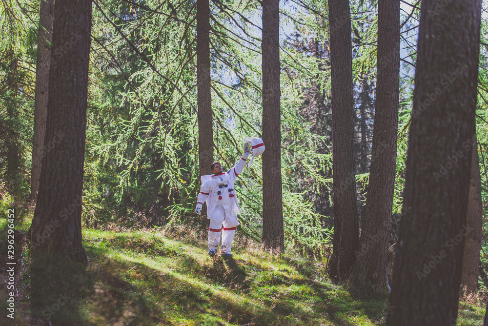 Wall mural astronaut exploring a new planet. searching for a new home for humanity. concept about science and n