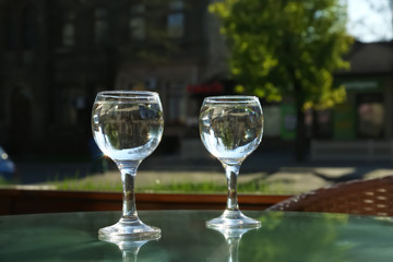 Two glasses of water at table in cafe, after coffee refreshing drink