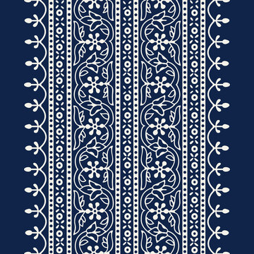 Woodblock printed indigo dye seamless ethnic floral wide geometric border. Traditional oriental ornament of India Kashmir, flowers wave and arcade motif, ecru on navy blue background. Textile design.