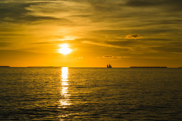Fototapeta na wymiar Colorful orange beautiful sunset on sea summer background. Hot and romantic sunset over the ocean. Calm landscape.