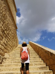 tourist on the tuff stairway, Victoria a gozo