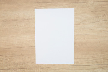 Blank paper sheets for brochure on wooden background. Mock up