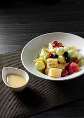 Delicious fruit salad, colorful fruit salad on table .