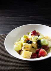 Delicious fruit salad, colorful fruit salad on table .