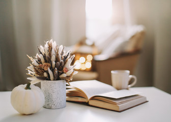 Autumn still life. Rustic style home decor. Still life details of living room. Autumn weekend concept. Fall home decoration.