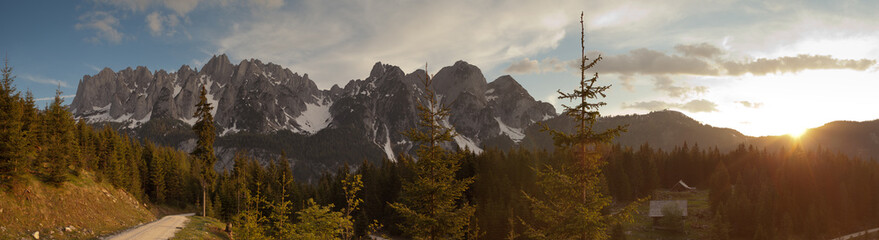 Panorama of Gosaukamm, Upper Austria in warm evening ligh with last bits of snow still visible on the northern site.