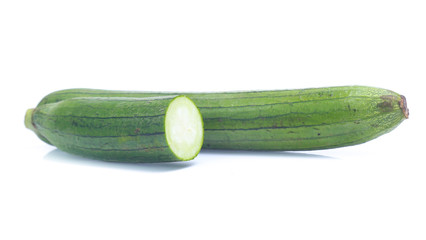 fresh green sponge gourd or luffa with slice isolated on white background