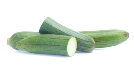 fresh green sponge gourd or luffa with slice isolated on white background