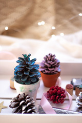 .Christmas Pinecones.Little Christmas Tree.  Christmas Pinecones painted in soft colors and Glitter. Christmas Lights .