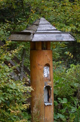 wooden birdhouse on a tree