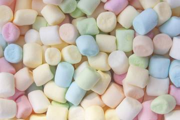 Colorful marshmallows as background, macro. Fluffy marshmallows texture close up.