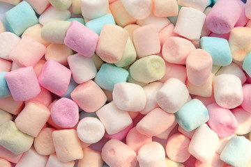 Colorful marshmallows as background, macro. Fluffy marshmallows texture close up.