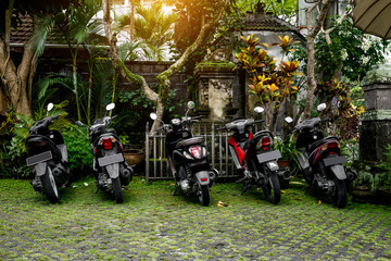 Motorcycles group parking on city street during adventure journey.