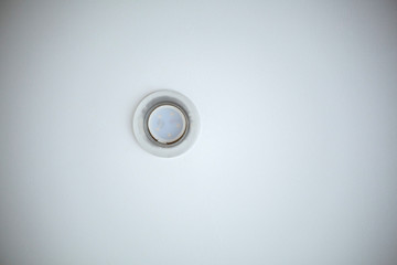 Electric spot fixed to the ceiling, white background.