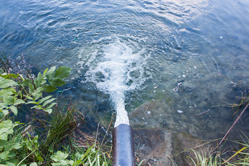 Sewage flows into the lake, river.Environmental pollution.