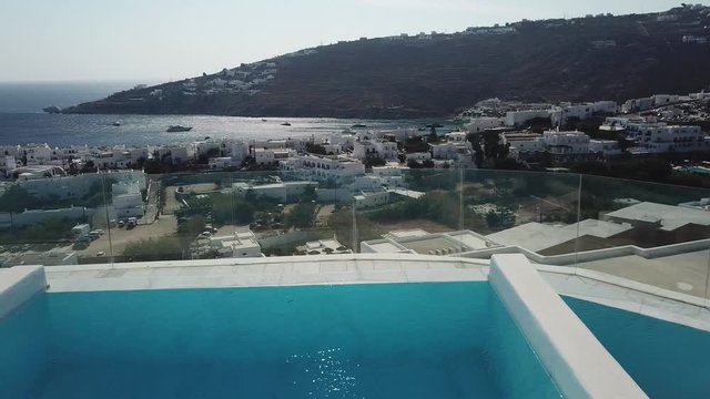 Mykonos Island Greece, Private Pool in Luxury Villa Aerial Revealing Amazing View on Beach
