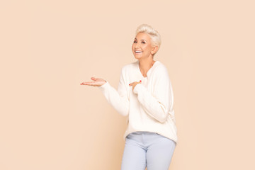 Smiling adult lady in cozy sweater.
