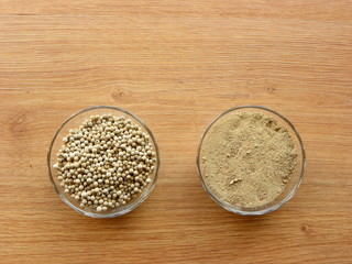 peppercorns and ground pepper in a glass bowl