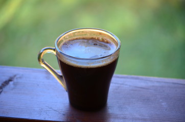 cup of coffee on wooden table