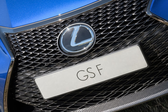 Closeup of an auto grille and registration plate on a Lexus GSF model vehicle luxury car in Laverstoke, Hampshire, UK - August 25, 2016