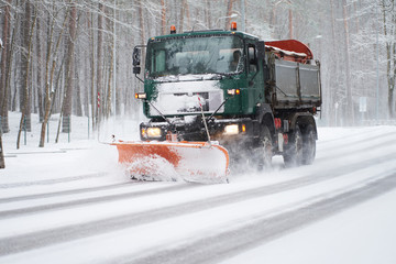 Snowplow truck at work of cleaning road