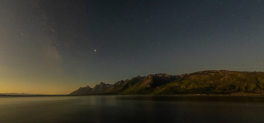 Dawn Breaks Over Starry Sky and Tetons Range