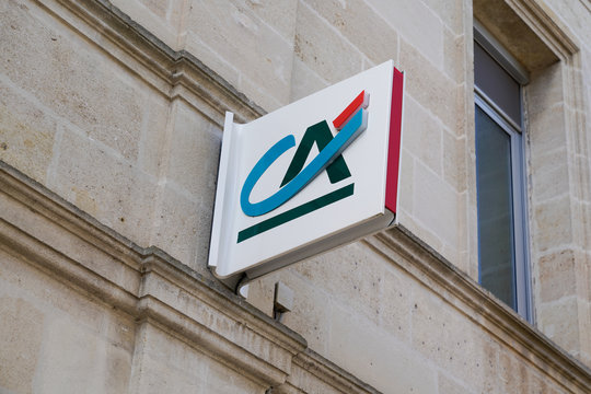 Credit Agricole sign logo on bank agency facade store office