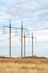 High voltage power line. High voltage pylons in cloudy evening weather.