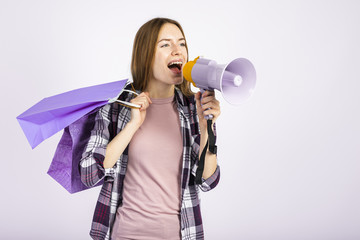 Mid shot woman using a megaphone