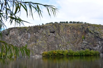 Beautiful landscape of the beginning of autumn on the river bank.