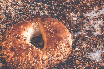 Authentic New York style freshly baked bagel sprinkled with black sesame and poppy seeds.