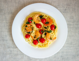 Italian pasta spaghetti with shrimps and tomatoes. National cuisine.