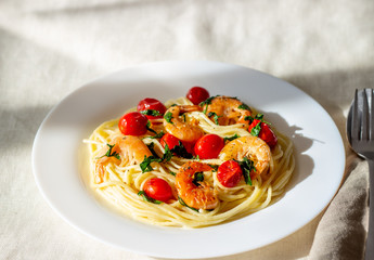 Italian pasta spaghetti with shrimps and tomatoes. National cuisine.