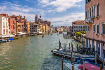 View of Grand Canal with gondolas and boats riding, Venice, Italy