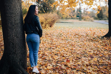 Happy mother and son in autumn city park