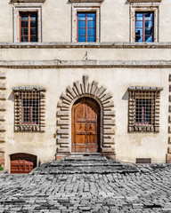 Fototapeta na wymiar Old Door of an Old Stone Building In Montepulciano Italy
