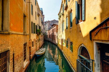 Fototapeta na wymiar Narrow water clans of Venice, Italy